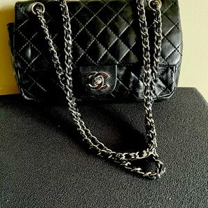 Chanel quilted Black leather handbag. used.